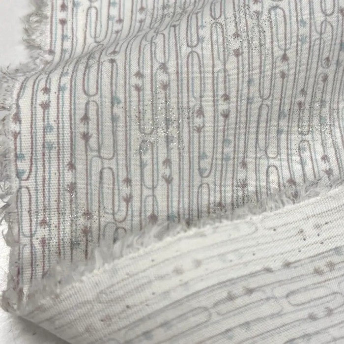 Tissu viscose coton imprimé flèches et étoiles argentées