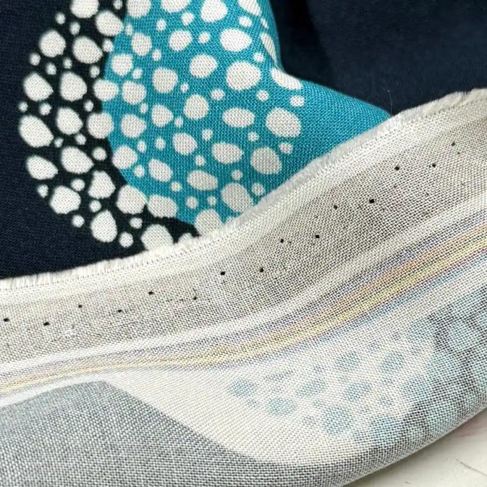 Tissu viscose coton grands pois blancs turquoise sur bleu marine foncé