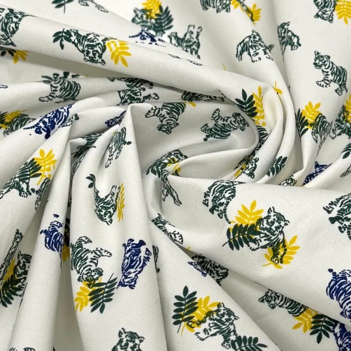 Tissu coton élasthanne tigres et feuillage sur fond blanc