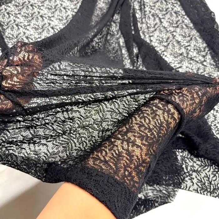 Tissu dentelle polyester élasthanne feuillage noir Haute Couture