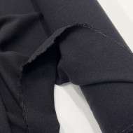 Tissu laine polyester aspect crêpe uni noir