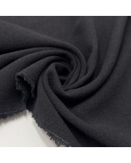 Tissu laine polyester aspect crêpe uni noir