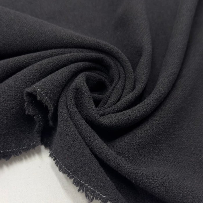 Tissu laine polyester aspect crêpe uni noir