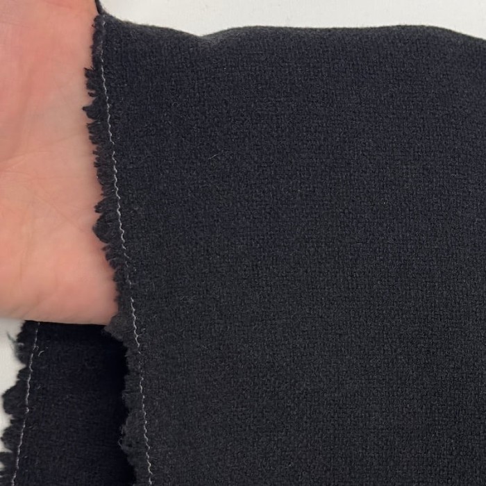 Tissu laine polyester aspect crêpe uni noir