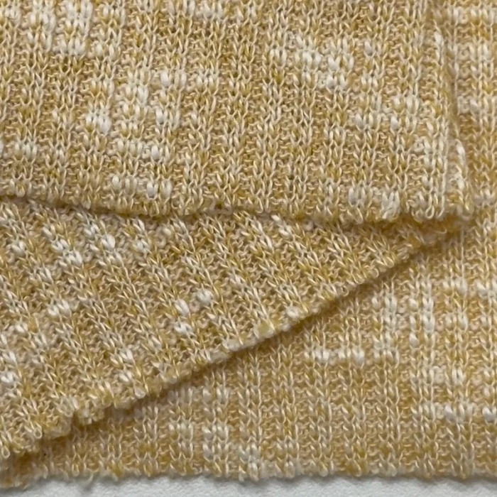 Tissu maille côtelé polyester coton moucheté jaune clair