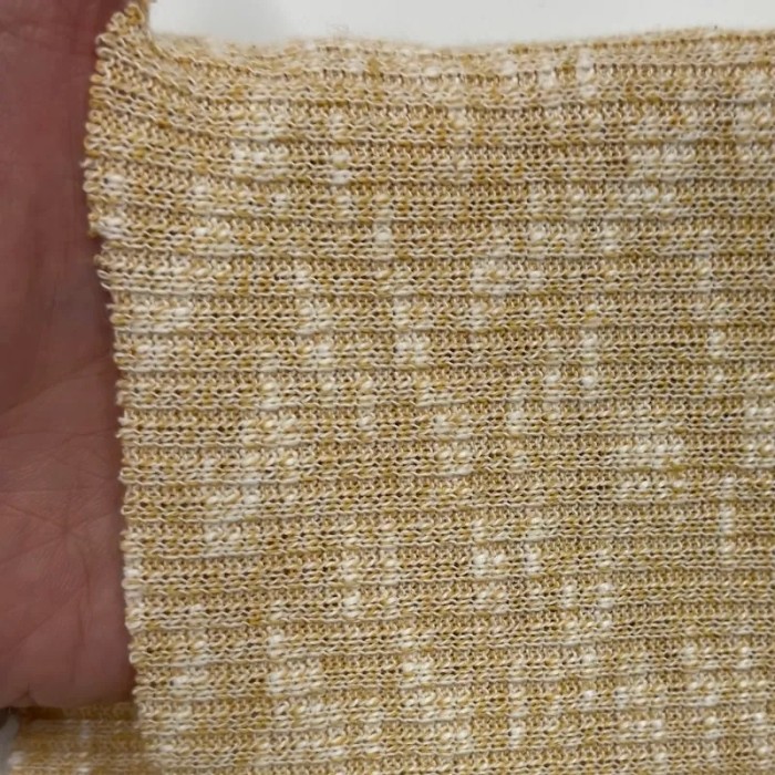 Tissu maille côtelé polyester coton moucheté jaune clair