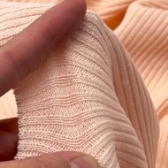 Tissu maille côtelé polyester élasthanne rose pâle