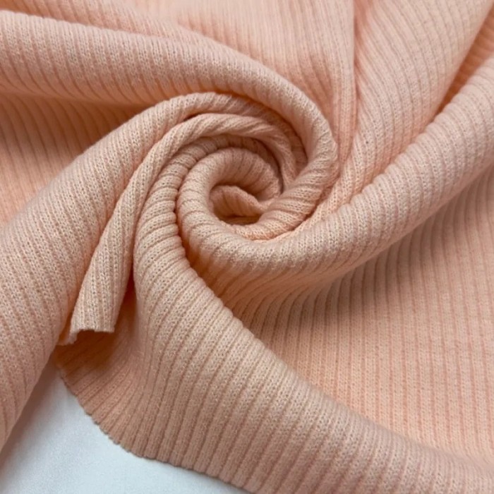 Tissu maille côtelé polyester élasthanne rose pâle