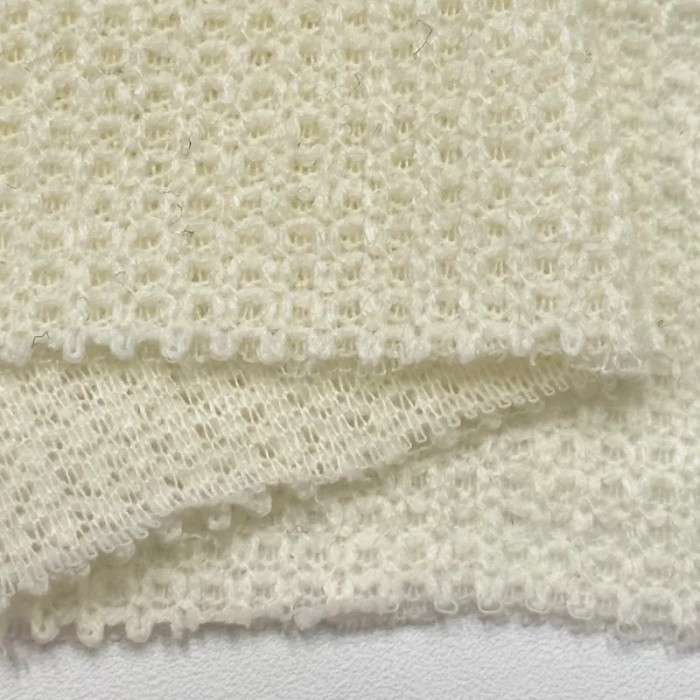 Tissu maille polyester polyacrylique uni ivoire