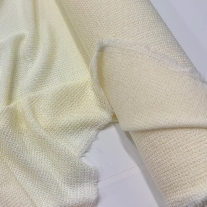 Tissu maille polyester polyacrylique uni ivoire