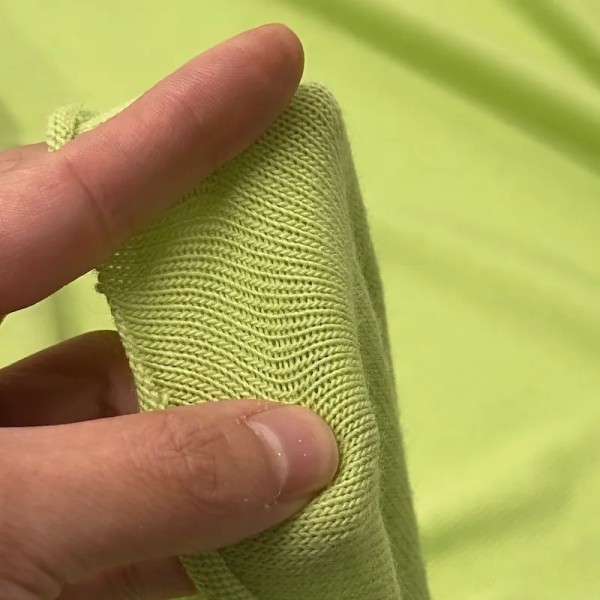 Tissu jersey polyester élasthanne uni vert pomme Tissu jersey polyester élasthanne uni vert pomme