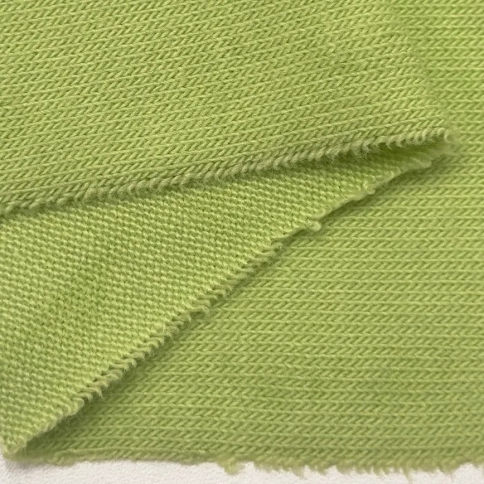 Tissu jersey polyester élasthanne uni vert pomme