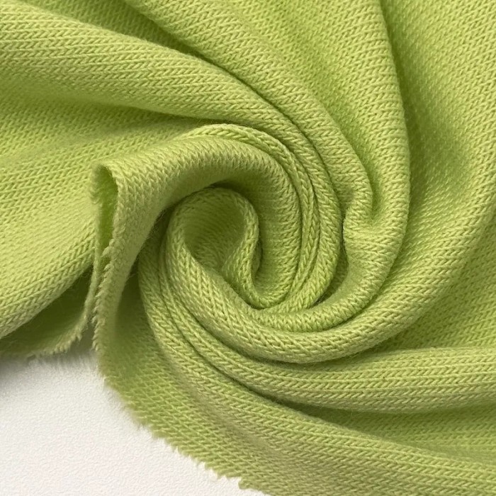 Tissu jersey polyester élasthanne uni vert pomme