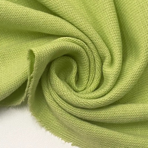 Tissu jersey polyester élasthanne uni vert pomme Tissu jersey polyester élasthanne uni vert pomme
