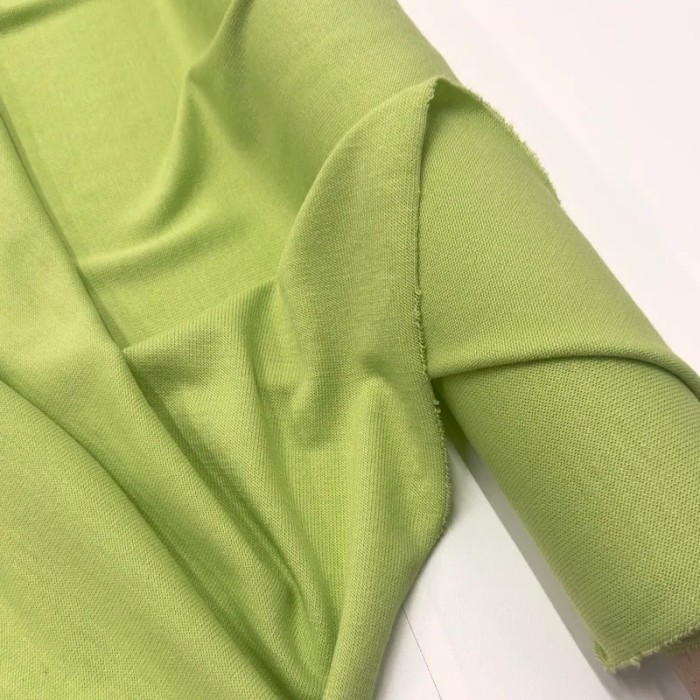 Tissu jersey polyester élasthanne uni vert pomme
