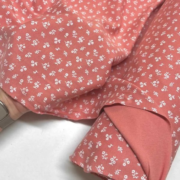 Tissu jersey coton fleurs corail - Marque française Tissu jersey coton fleurs corail - Marque française