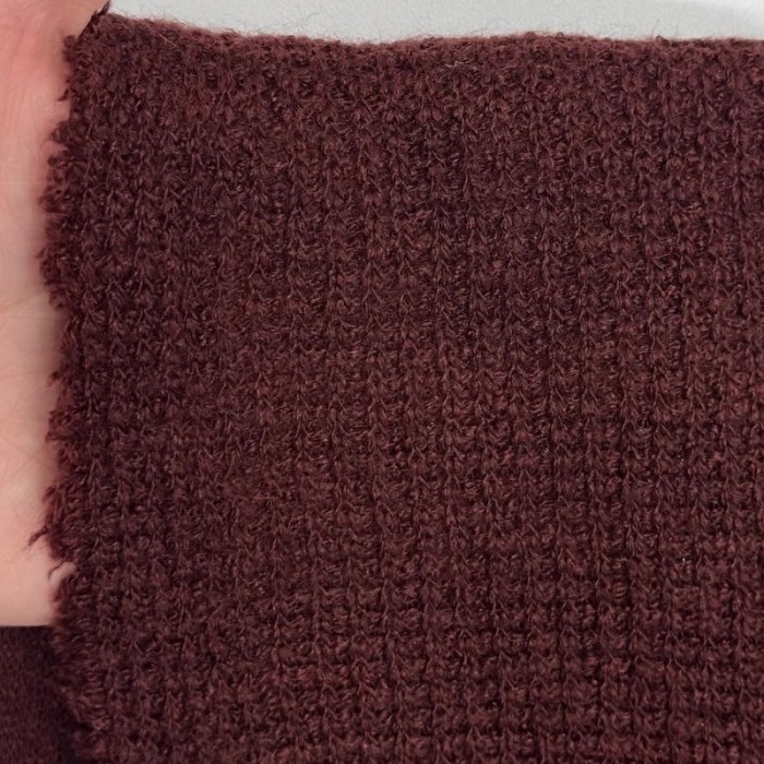 Tissu maille nid d'abeille polyester effet tricot uni bordeaux Tissu maille nid d'abeille polyester effet tricot uni bordeaux