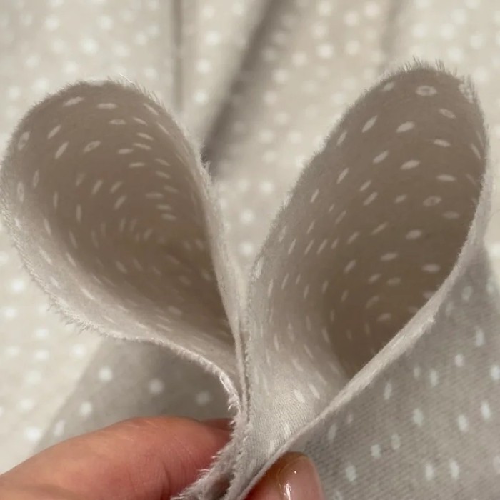 Tissu coton cretonne gratté petits pois blancs sur fond beige