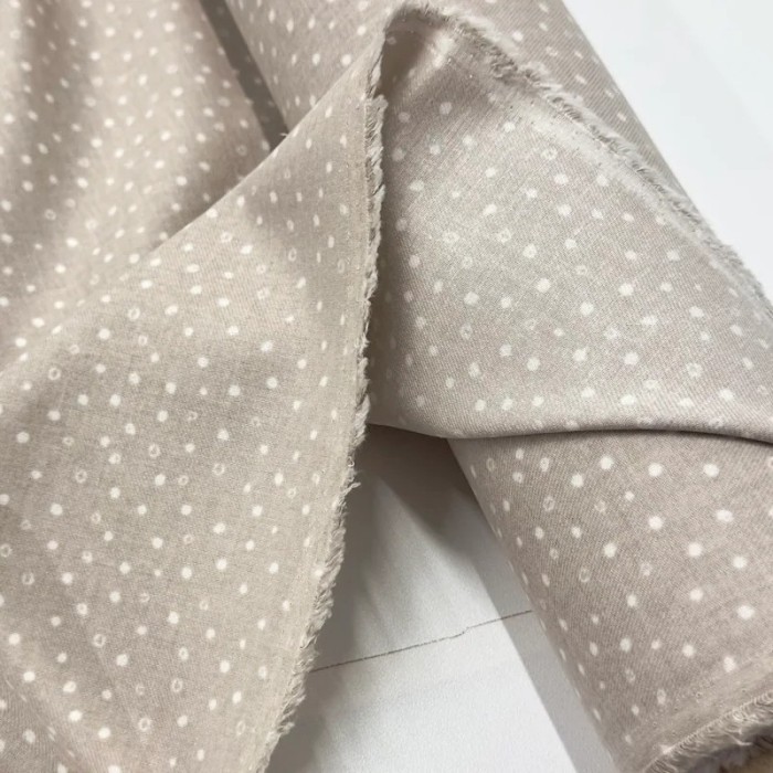 Tissu coton cretonne gratté petits pois blancs sur fond beige