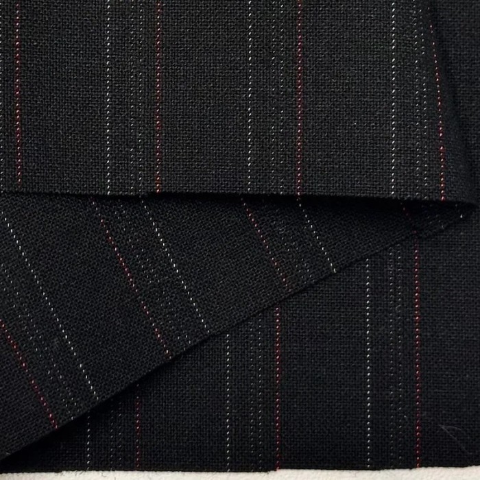 Tissu laine élasthanne tailleur à fines rayures sur fond noir Tissu laine élasthanne tailleur à fines rayures sur fond noir