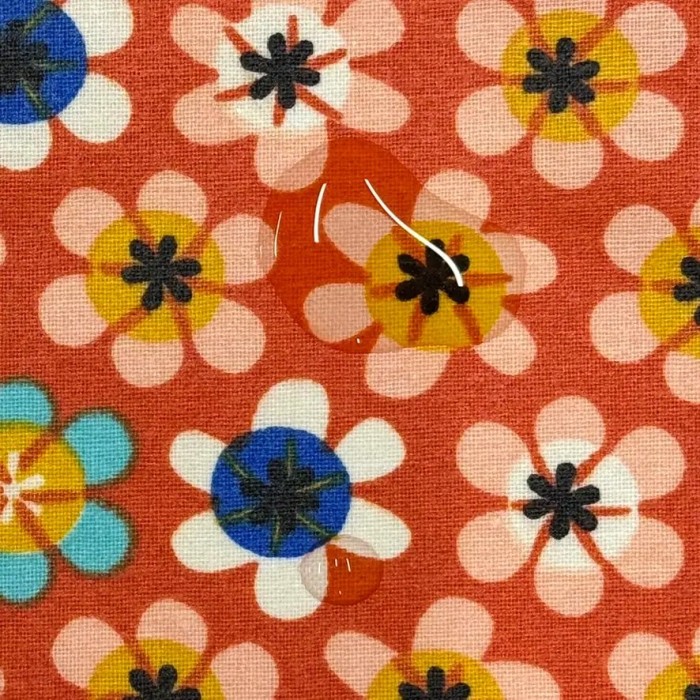 Tissu coton enduit Nami fleuri orange