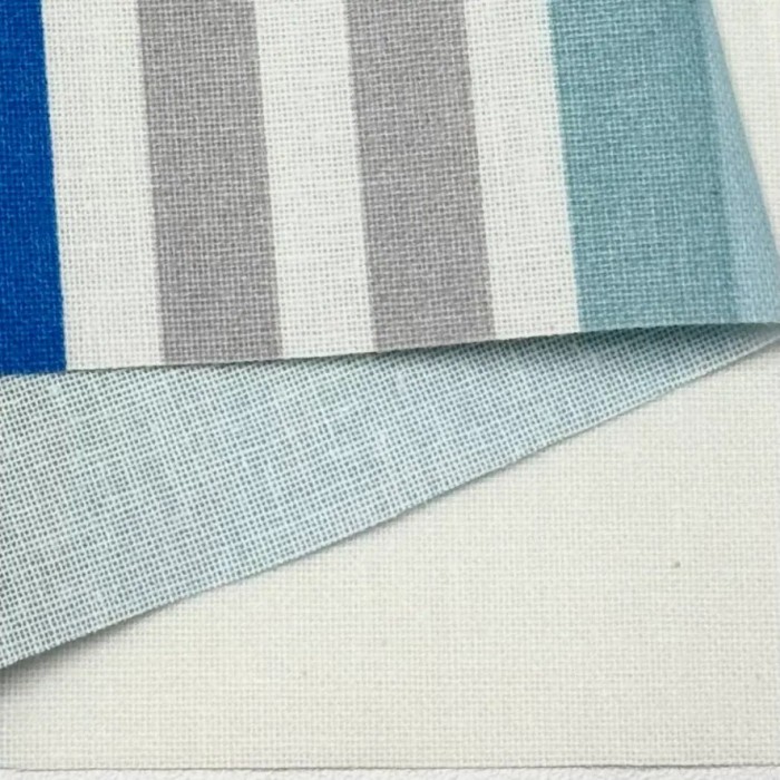 Tissu coton enduit Tcha tcha à rayures multi-couleurs bleu ciel ocre