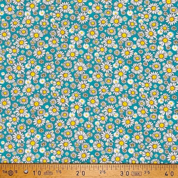 Tissu coton imprimé marguerite turquoise Tissu coton imprimé marguerite turquoise