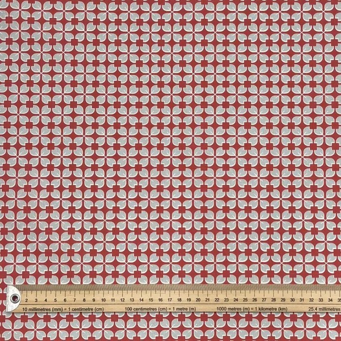 Tissu coton enduit Rodrigo géométrique bleu ciel sur rouge