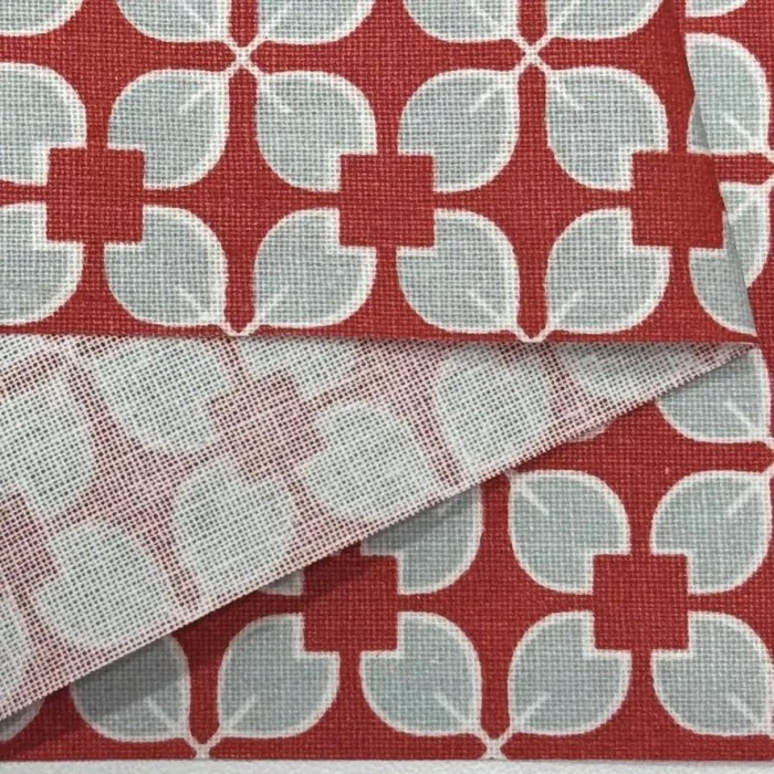 Tissu coton enduit Rodrigo géométrique bleu ciel sur rouge