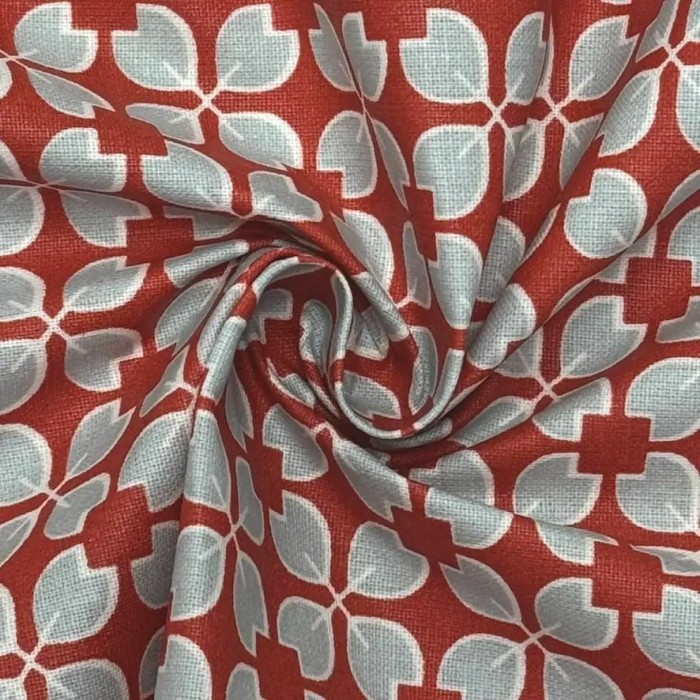 Tissu coton enduit Rodrigo géométrique bleu ciel sur rouge