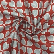 Tissu coton enduit Rodrigo géométrique bleu ciel sur rouge