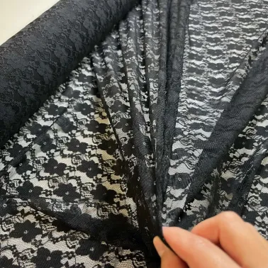 Tissu polyester dentelle fleurs noir