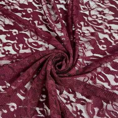 Tissu polyester dentelle fleurs bordeaux