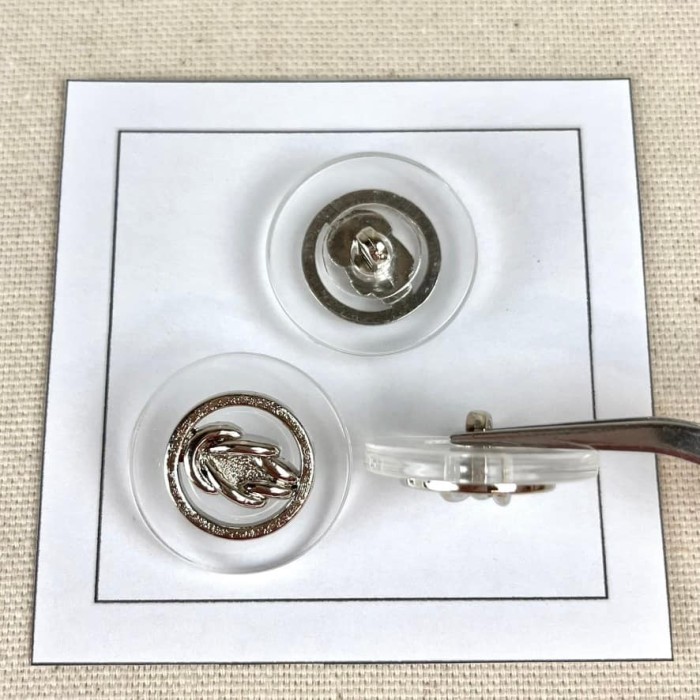 Bouton plastique nœud marin argenté 25mm Bouton plastique nœud marin argenté 25mm