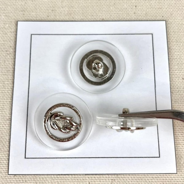 Bouton plastique nœud marin argenté 25mm Bouton plastique nœud marin argenté 25mm
