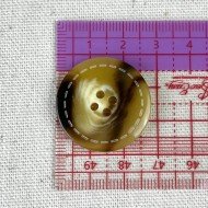 Bouton plastique effet corne contour piqué 28mm