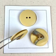 Bouton plastique marbré crème 26mm