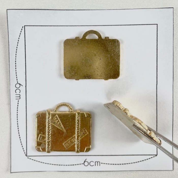 Charm valise doré Charm valise doré