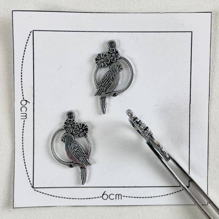 Charm rond argenté Charm rond argenté