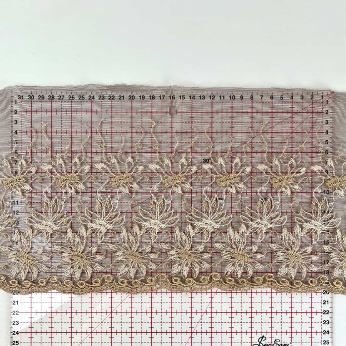 Dentelle fleurs blanches dorés sur tulle marron 20cm