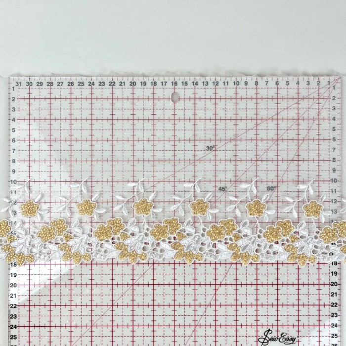 Dentelle fleurs dorés sur tulle blanc 18cm