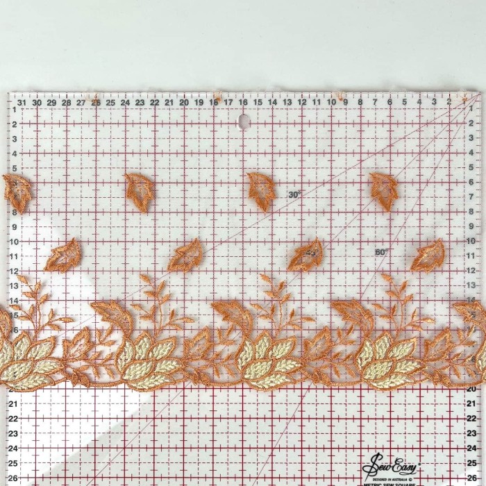 Dentelle feuilles jaunes oranges sur tulle blanc 20cm Dentelle feuilles jaunes oranges sur tulle blanc 20cm