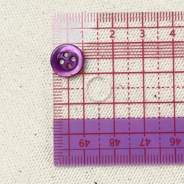 Bouton nacre rond violet 10mm Bouton nacre rond violet 10mm