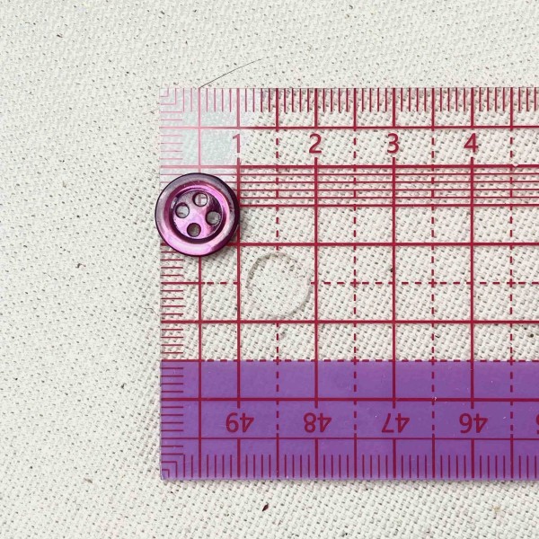 Bouton nacre rond pourpre 10mm Bouton nacre rond pourpre 10mm