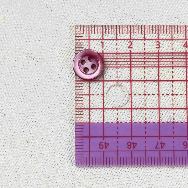 Bouton nacre rond mauve 10mm Bouton nacre rond mauve 10mm