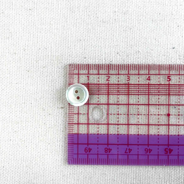 Bouton rond nacre blanc 10mm Bouton rond nacre blanc 10mm