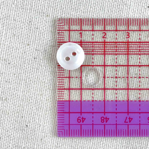 Bouton rond nacre blanc 12mm Bouton rond nacre blanc 12mm