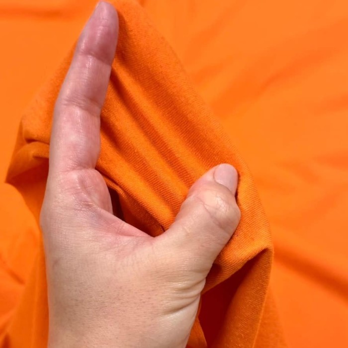Tissu jersey coton polyester orange - Marque Française Tissu jersey coton polyester orange - Marque Française