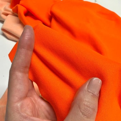 Tissu haute visibilité maille piqué polyester orange néon Tissu haute visibilité maille piqué polyester orange néon