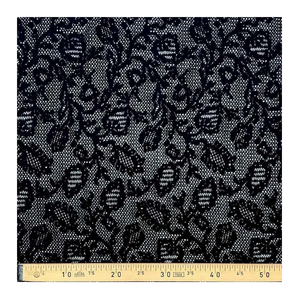 Tissu dentelle noir motifs arabesques fleuries